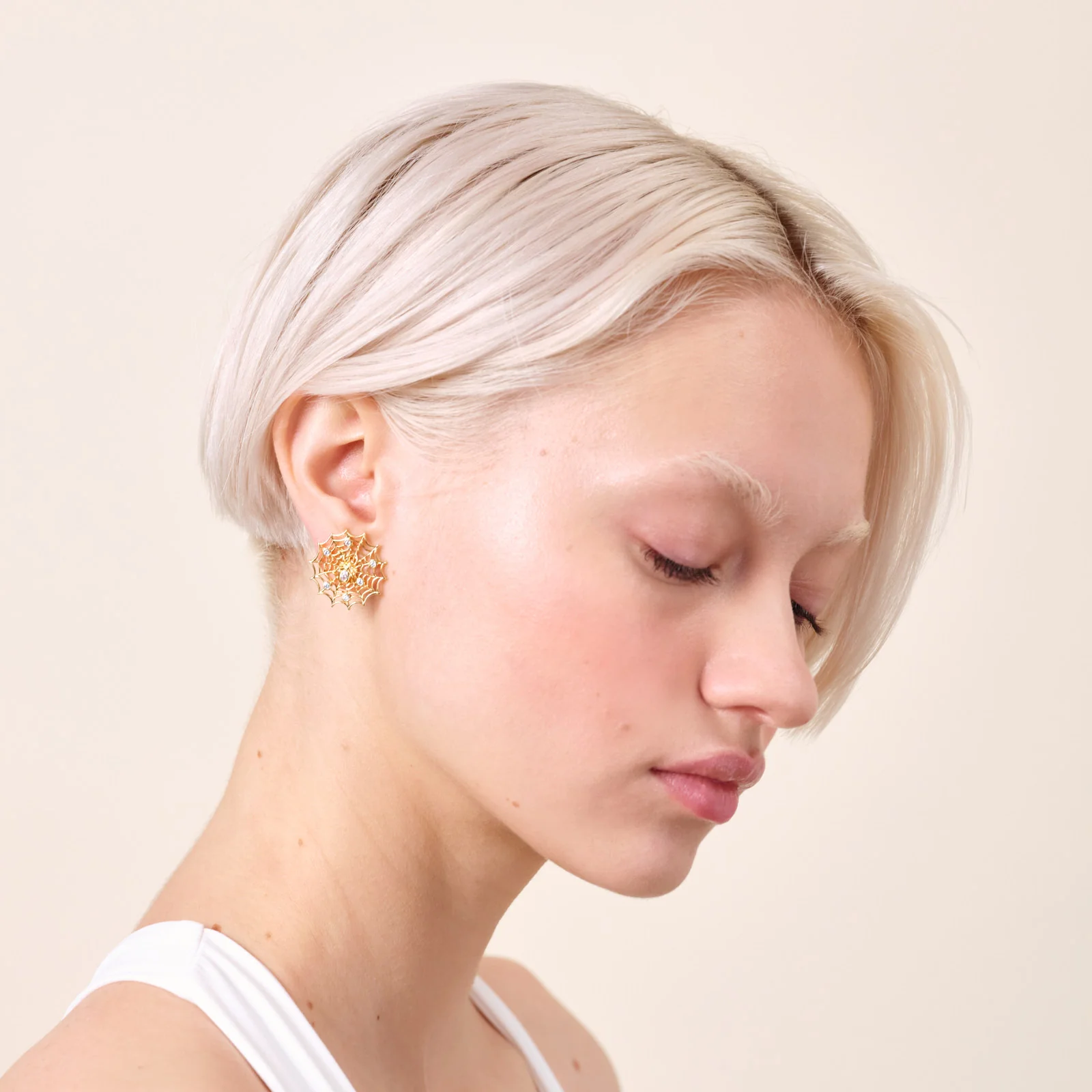 Boucles d'oreilles dorées toile d'araignée et cristaux - Image 2