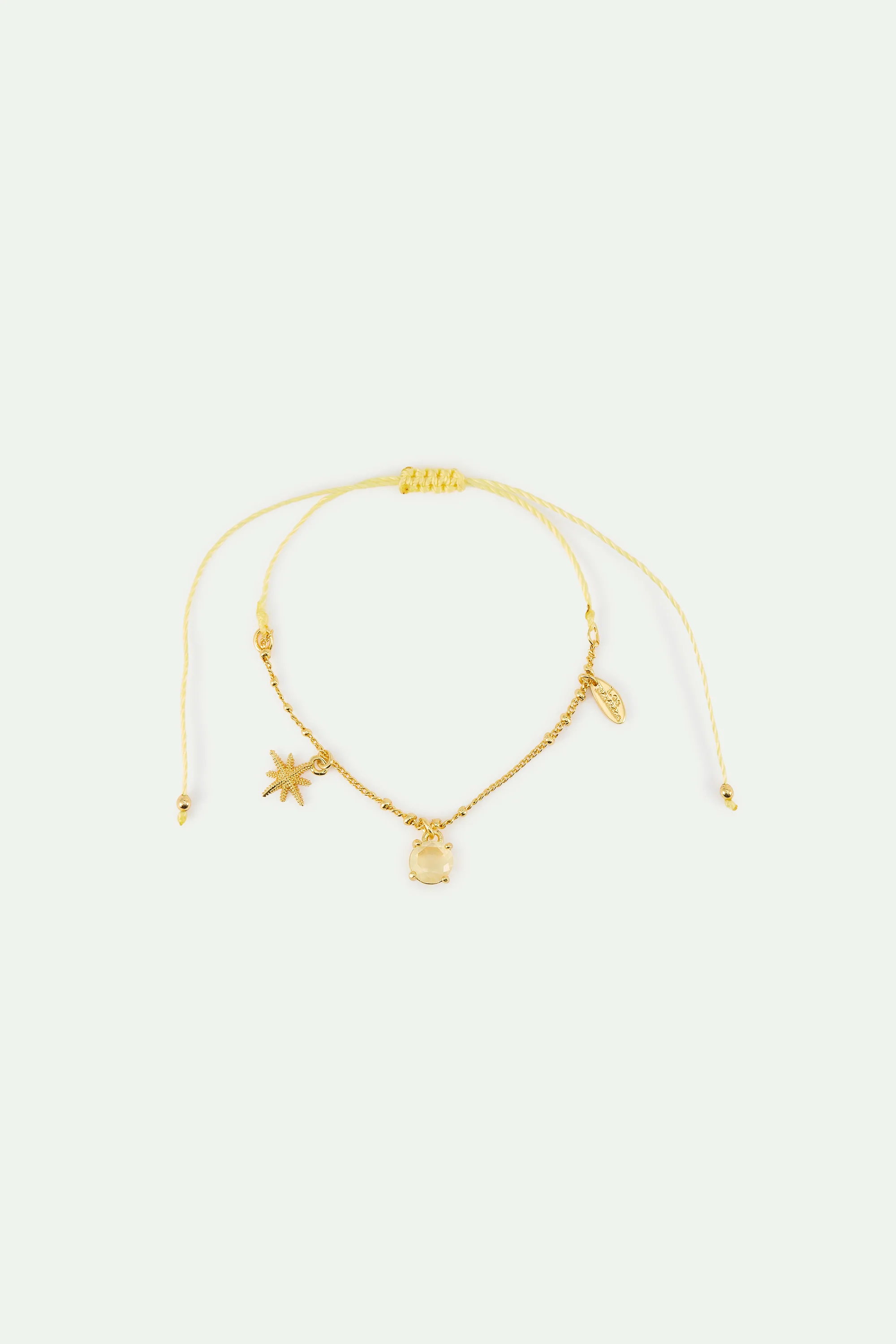 Bracelet fin étoile dorée et pierre jaune